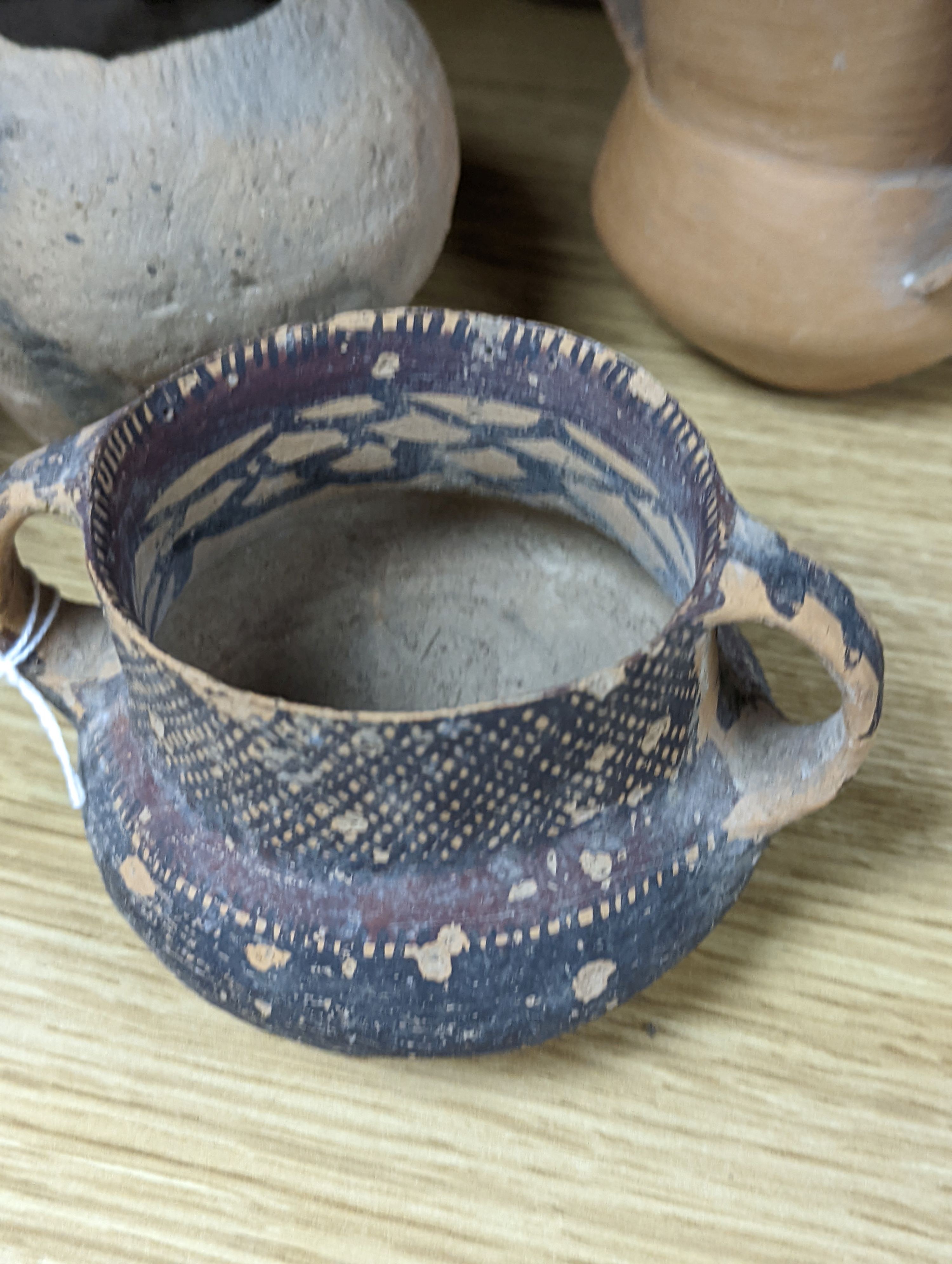 Four Chinese Neolithic pottery vessels, 11cm